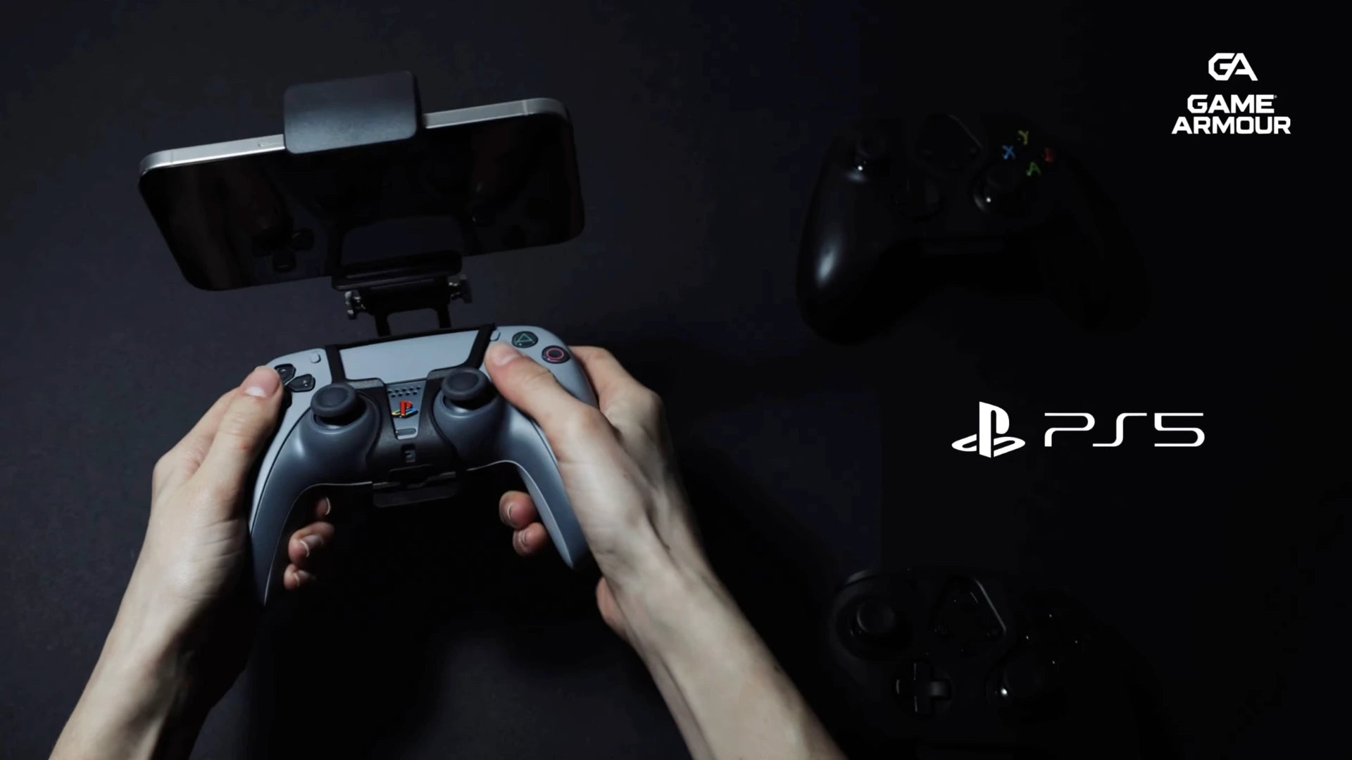 Load video: Game Armour mobile gaming mount attaching a smartphone to a PS5 and Xbox controller, demonstrating portable console gaming using Remote Play and the ease of being able to switch controller type in seconds
